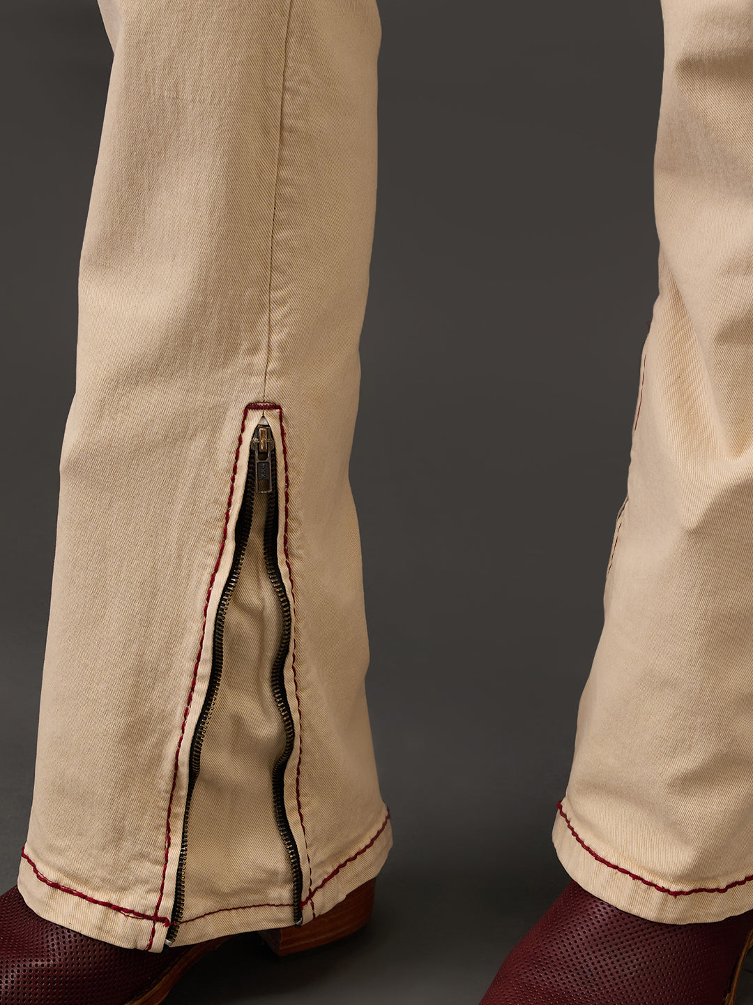 Beige Bootcut Jeans – Maroon Saddle Stitch with Zippered Bottom Detail